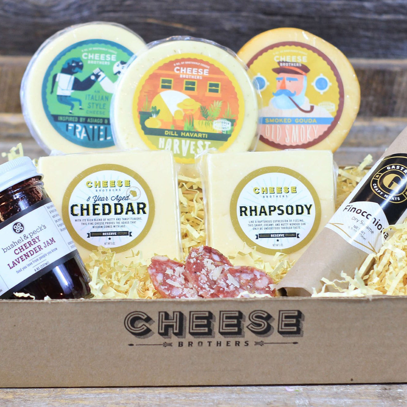Cheese Brothers charcuterie delivery box with cheese, jam, and dry age salami.
