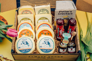 Deluxe Mother's Day gift box with ten packages of gourmet Wisconsin cheeses, organic crackers, jams, honey, and sausages. 