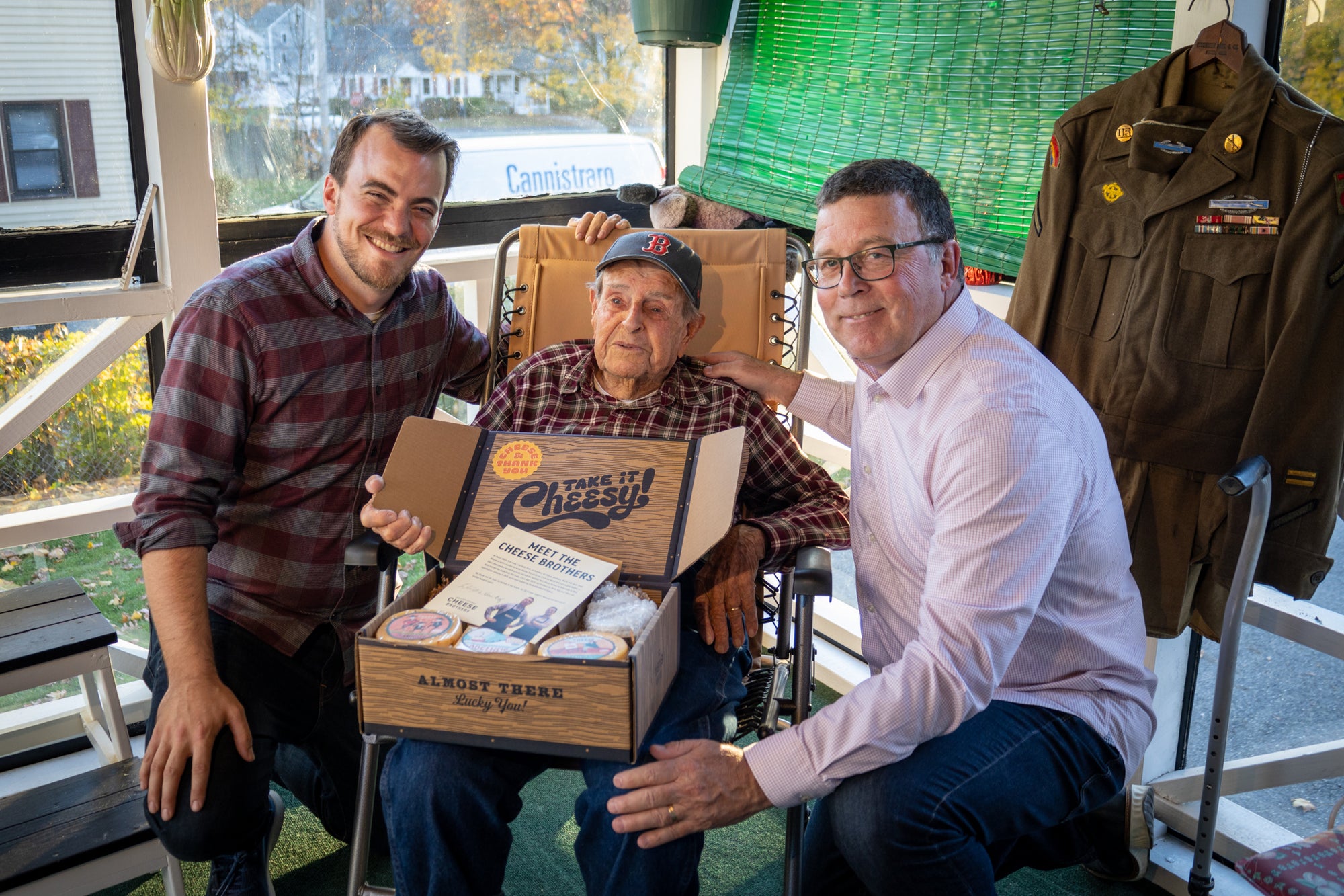 Cheese Brothers founders giving a gift box to a veteran. 