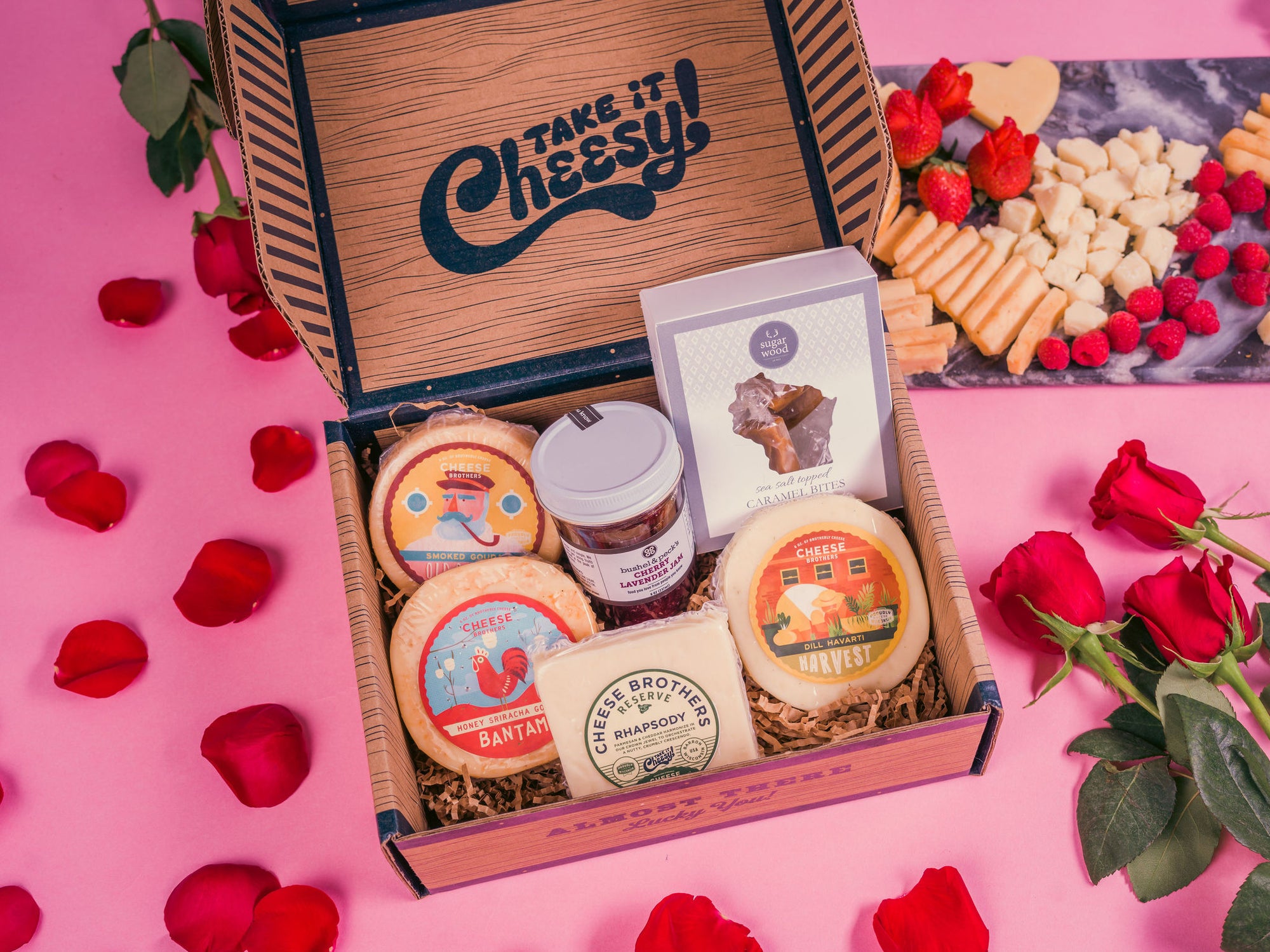 Valentines Day Cheese box with four varieties of gourmet cheeses, jam, and caramel bites. 