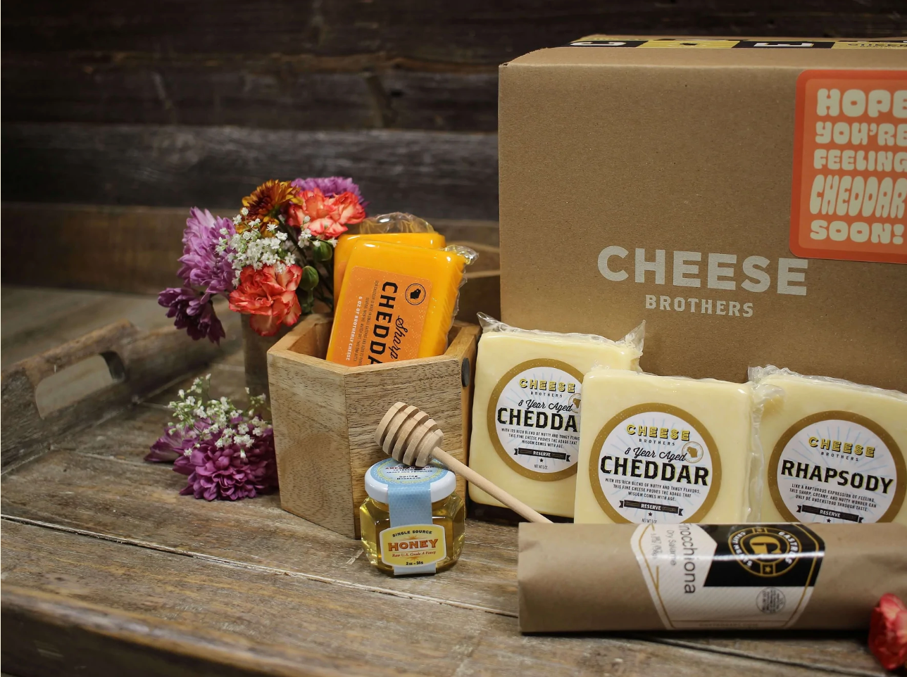 Get Well Soon cheese box with five blocks of gourmet Wisconsin cheese, honey, and sausage. 