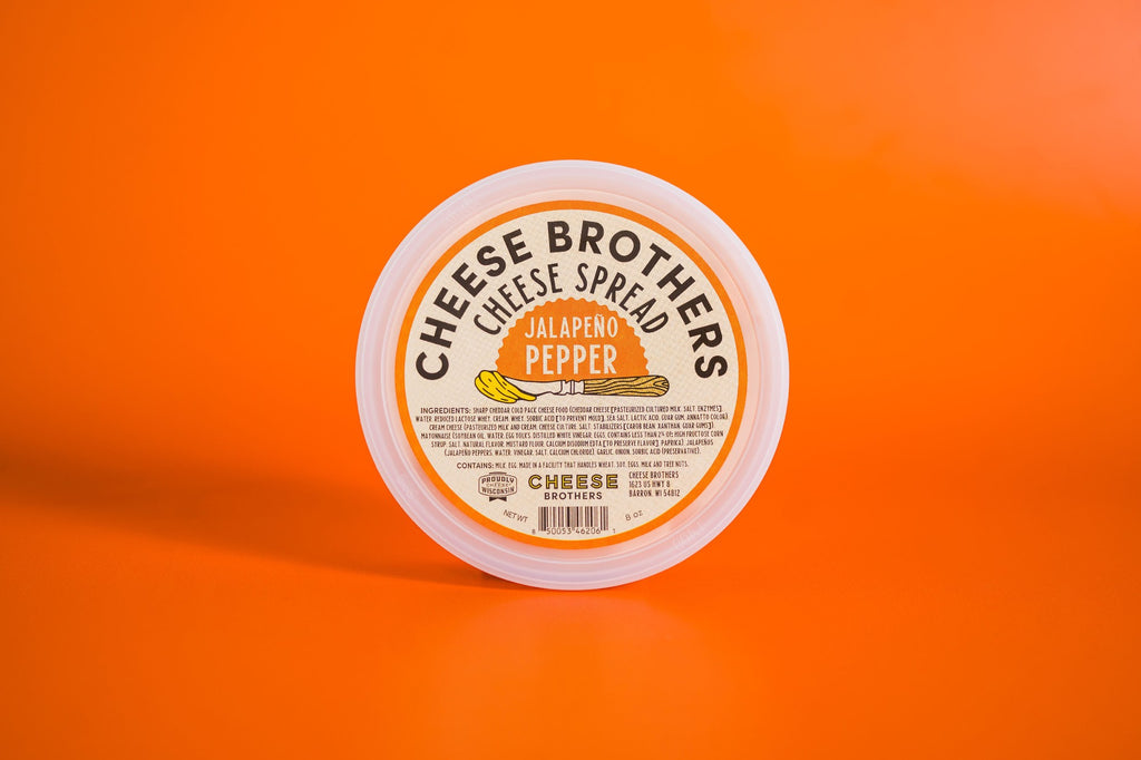 Container of jalapeno pepper cheese spread. 