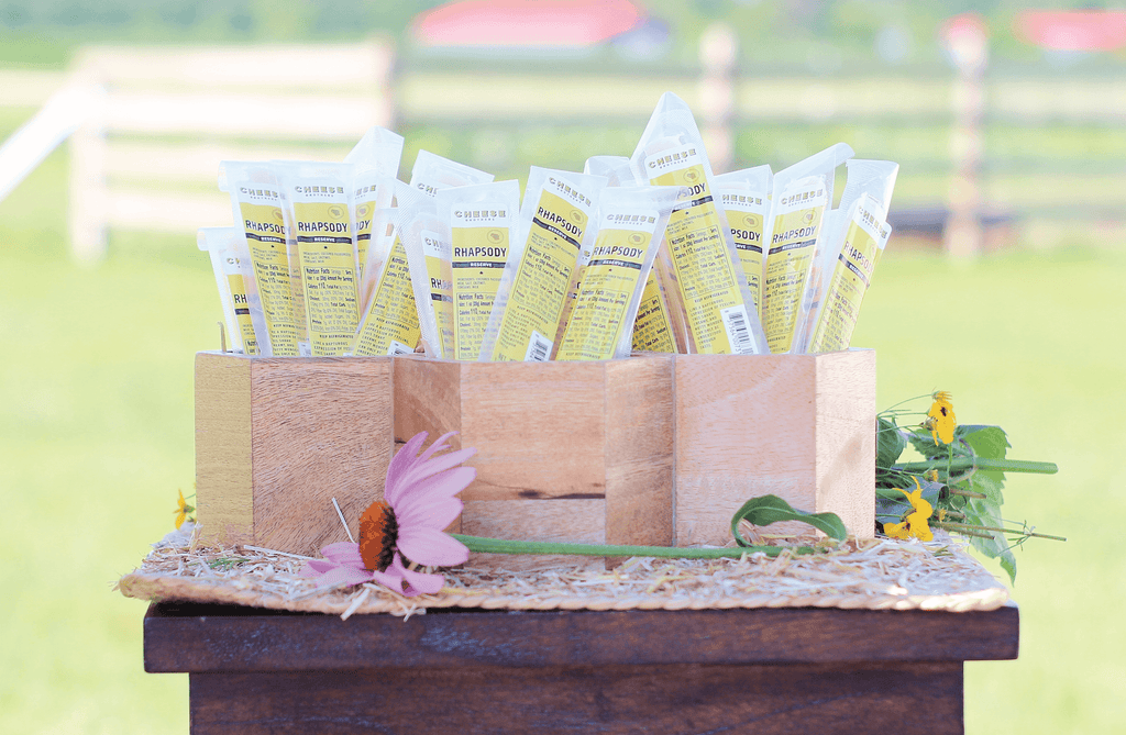 Three boxes with rhapsody gourmet cheese sticks. 