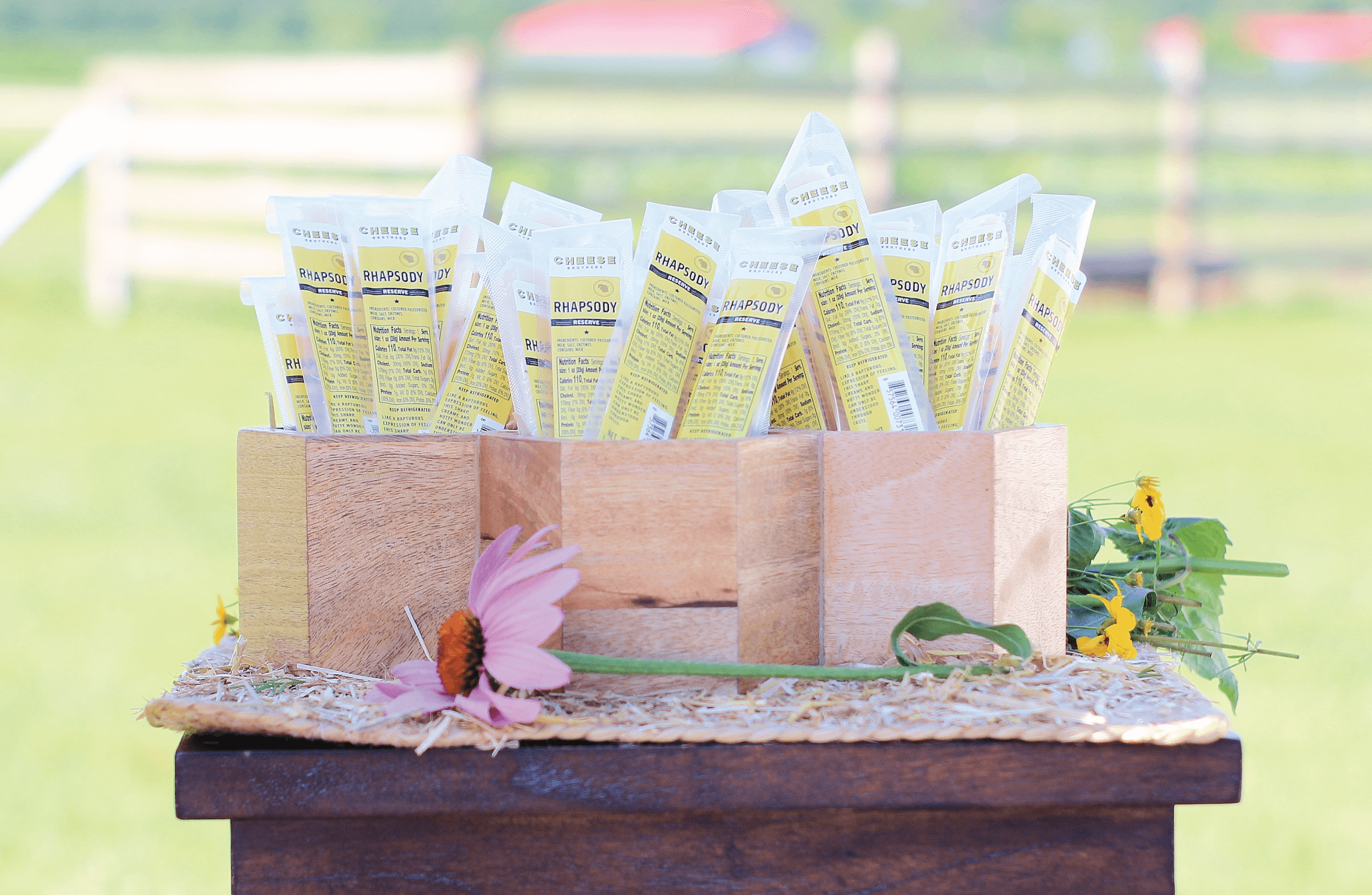 Three boxes with rhapsody gourmet cheese sticks. 