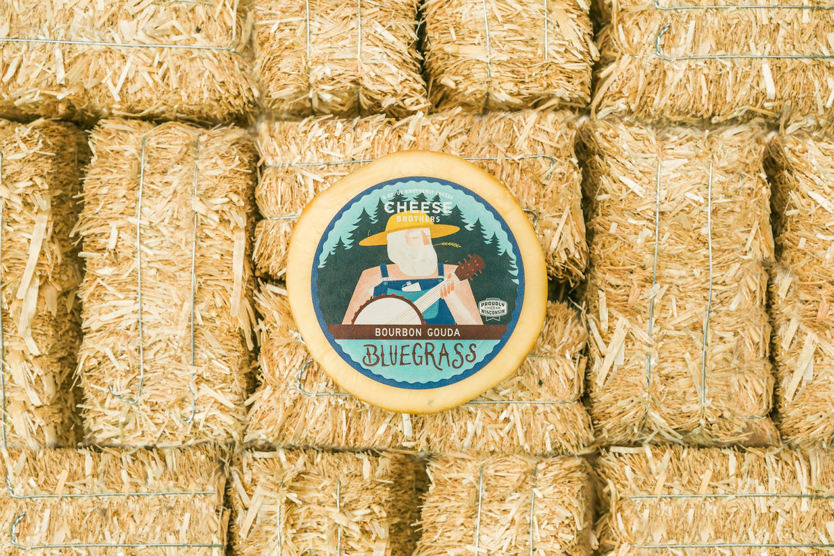 Package of bluegrass bourbon gouda on a haystack. 