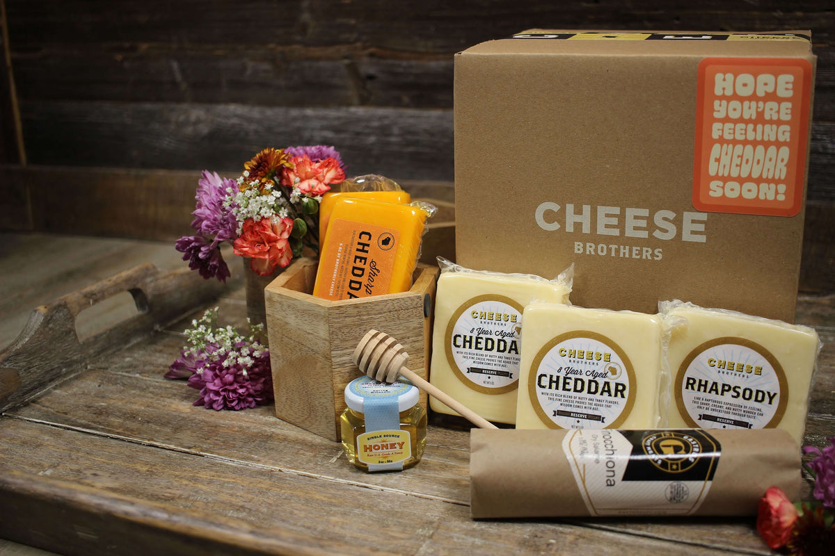 Get Well Soon cheese box with five blocks of gourmet Wisconsin cheese, honey, and sausage. 