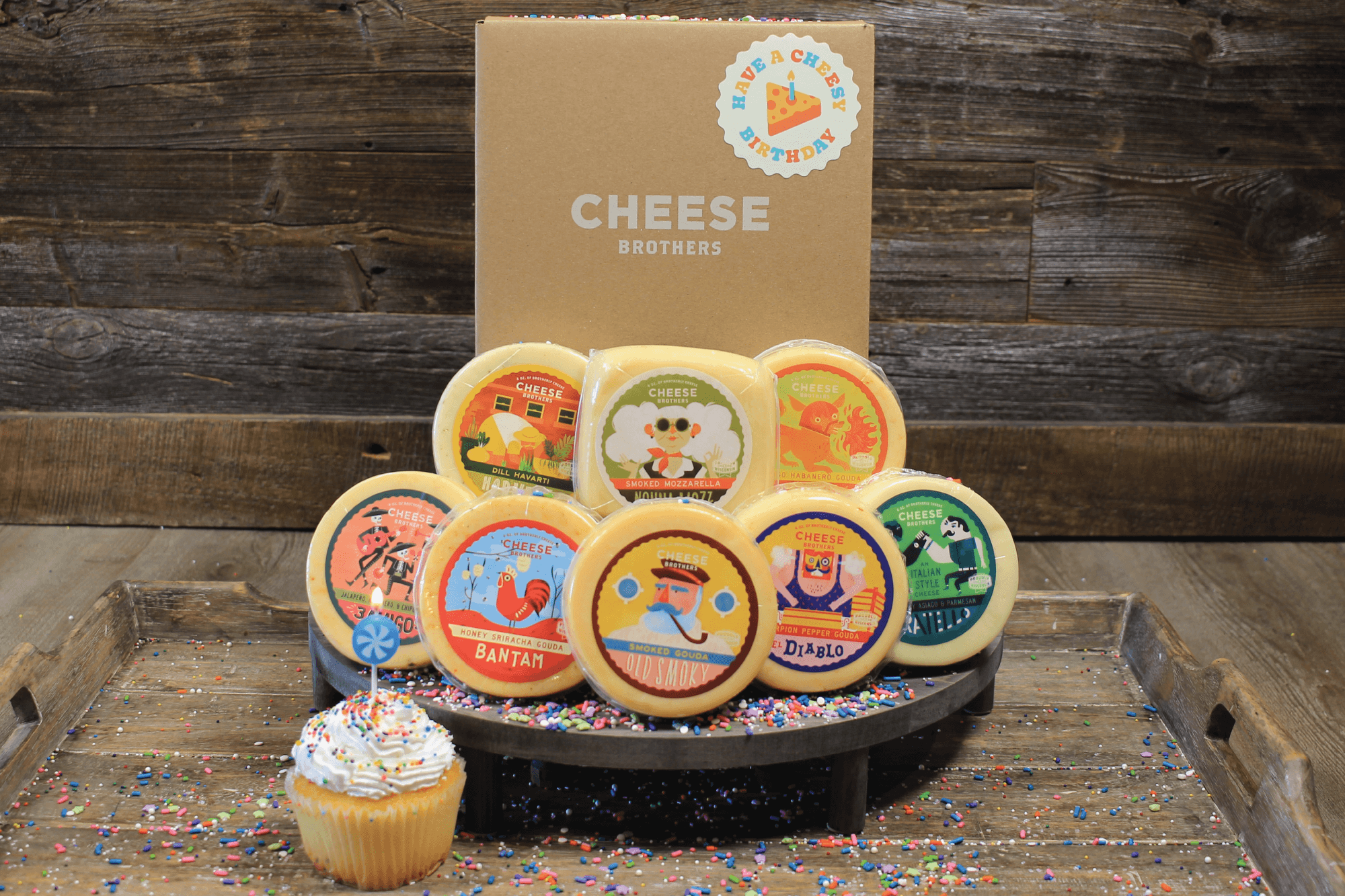 Birthday gift box with eight varieties of gourmet Wisconsin cheeses.