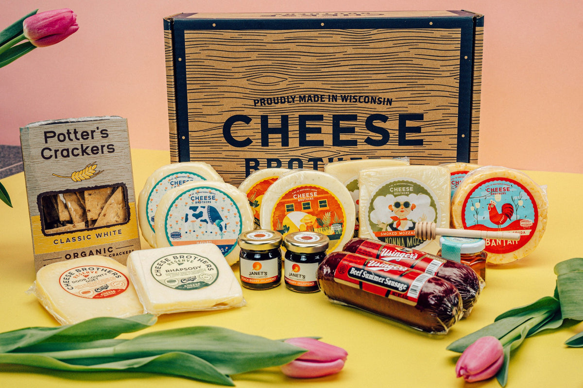 Deluxe Mother&#39;s Day gift box with ten packages of gourmet Wisconsin cheeses, organic crackers, jams, honey, and sausages. 