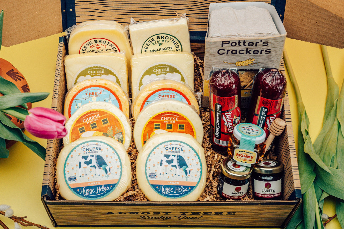 Deluxe Mother&#39;s Day gift box with ten packages of gourmet Wisconsin cheeses, organic crackers, jams, honey, and sausages. 