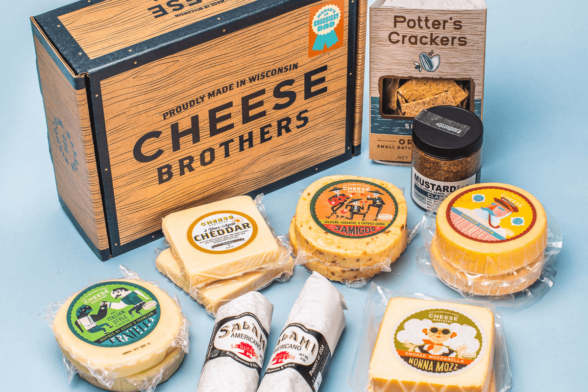 Father&#39;s Day gift box with ten packages of gourmet Wisconsin cheese, two salamis, organic crackers, and mustard. 