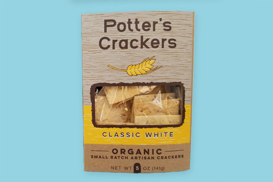 The front of the packaging for Potter's small batch organic artisan crackers.