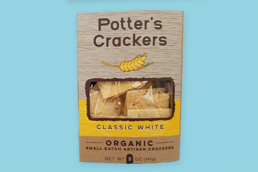 The front of the packaging for Potter&#39;s small batch organic artisan crackers.